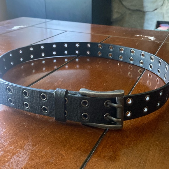 Belt with metal eyelets Approximately 38 inches long. Man made material. - Picture 1 of 8